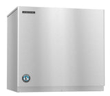 A stainless steel Hoshizaki Serenity Ice Maker with a sleek, boxy design. The cube-style machine features a brushed metal finish, logo on the top left, and a blue circular emblem near the bottom, highlighting its industrial appeal.