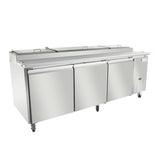 A large stainless steel refrigerated prep table with three doors and wheels. The unit features a flat workspace on top with covered compartments, ideal for preparing and storing food ingredients in a professional kitchen setting.