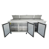A large stainless steel refrigerated prep table with three open top lids and three open front doors revealing interior wire shelves; the unit is on wheels and has a flat work surface, perfect as a pizza prep table.