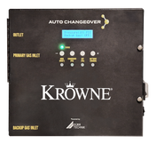 A black Krowne KR-ACO Gas Auto-change over unit featuring a digital display reads “Pressure: 101 PSI, Backup Gas: OFF.” Labeled connections for Outlet, Primary Gas Inlet, and Backup Gas Inlet accompany intuitive buttons and indicator lights.