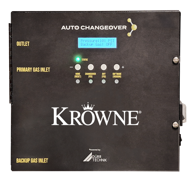 A black Krowne KR-ACO Gas Auto-change over unit featuring a digital display reads “Pressure: 101 PSI, Backup Gas: OFF.” Labeled connections for Outlet, Primary Gas Inlet, and Backup Gas Inlet accompany intuitive buttons and indicator lights.