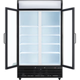 A commercial refrigerator with two glass swing doors stands open, revealing five empty white wire shelves on each side. The interior is brightly lit; the exterior is black with a vented bottom panel and blank white display area at the top.