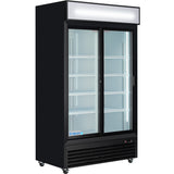 A commercial refrigerator with a black exterior, two glass sliding doors, interior shelves, and a blank lighted sign panel on top. This refrigerated merchandiser sits empty on small wheels with a vented compressor panel at the bottom.