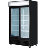 A large commercial refrigerator with glass sliding doors, a sleek black exterior, adjustable white shelves, an illuminated blank panel on top, and wheels for mobility. This refrigerated merchandiser is empty and ready for use.