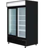 A large, black merchandiser refrigerator with glass sliding doors and interior shelves. The fridge is empty, lit by vertical LED lights inside, and sits on four small wheels. The top features a blank white sign panel for commercial refrigeration use.