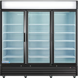 A large, commercial display cooler with three glass doors and multiple empty white shelves. The black frame and bright, cool lighting highlight the spacious interior. A small Empura logo is visible in the lower left corner of this refrigerated merchandiser.