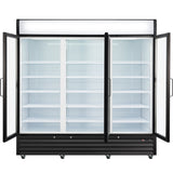 A large commercial refrigeration unit with black framing, double glass doors opened wide, and six empty white wire shelves on each side. This display cooler is brightly lit inside, stands on small wheels, and features a blank illuminated sign panel above.