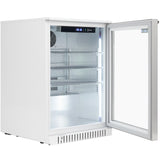 A modern, white undercounter refrigerator sits on a white surface with its glass door open. The interior is brightly lit with LED lights, revealing three adjustable wire shelves and a digital control panel at the top. The fridge appears clean and empty.