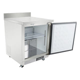 An Empura Refrigeration stainless steel commercial freezer with an open door reveals a spacious interior and a single wire shelf. The undercounter reach-in refrigerator features a dimpled white insulation panel, casters, and a bottom control panel.