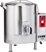A large, stainless steel commercial tilt skillet resembling a stationary kettle, with a black handle, control panel featuring dials and switches, temperature gauge, “Vulcan” branding, four sturdy legs, and a handled lid on top.