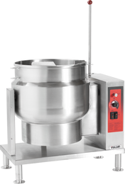 A large stainless steel commercial Tilting Kettle with control panel, red accents, and a long handle. The unit stands on four legs, features a spout for pouring, and is branded “Vulcan” at the base. The control panel includes knobs and switches.