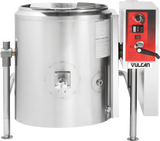 A large industrial 40-gallon stainless steel tilting kettle with a control panel on the right, labeled “Vulcan.” The gas-powered kettle features a spout, handles, gauges, and lid, supported by sturdy metal legs and equipped with buttons and indicator lights.