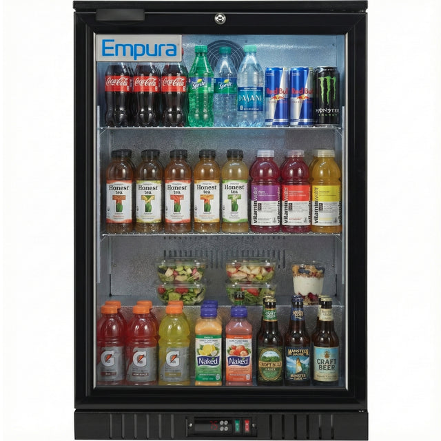 An Empura LG-138HA-B glass door merchandiser displays assorted bottled and canned drinks—sodas, water, tea, juice, energy drinks, and beer—neatly arranged on three shelves with salad bowls on the bottom shelf.