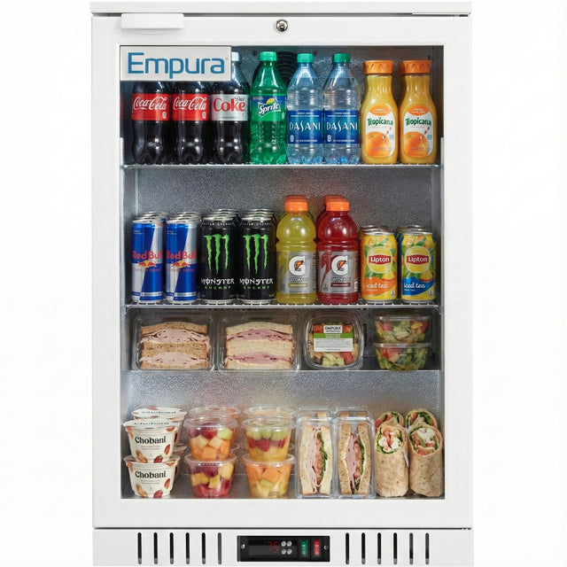 A refrigerator merchandiser stocked with soda cans, bottled water, and juice on top; sports drinks and iced tea in the middle; wraps, sandwiches, salads, fruit cups, and Chobani yogurt at the bottom. The Empura LG-138HA-W is perfect for organized display.