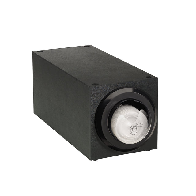 A rectangular black electronic device with a glossy circular lens on the front, resembling a stackable lid dispenser or projector. The matte body features visible screws on the corners. The spiraled lens shows a faint reflection and subtle industrial design.