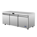 A commercial Atosa AUR72SD stainless steel undercounter refrigerator with three front doors, black handles, a smooth flat top, and small wheels. The clean, industrial unit features the Arctic Air logo on the lower right front panel.