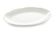 A large, oval-shaped white Frostone Collection melamine tray with a subtle, textured dimpled pattern and a slightly scalloped rim, photographed on a plain white background. The dishwasher safe tray is empty and angled slightly to the left.
