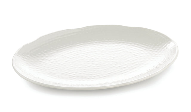 A large, oval-shaped white Frostone Collection melamine tray with a subtle, textured dimpled pattern and a slightly scalloped rim, photographed on a plain white background. The dishwasher safe tray is empty and angled slightly to the left.