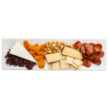 A rectangular white Frostone Collection Dish displays sliced salami, two kinds of cheese wedges, square crackers, whole almonds, dried apricots, and glazed pecans—all arranged neatly in rows.