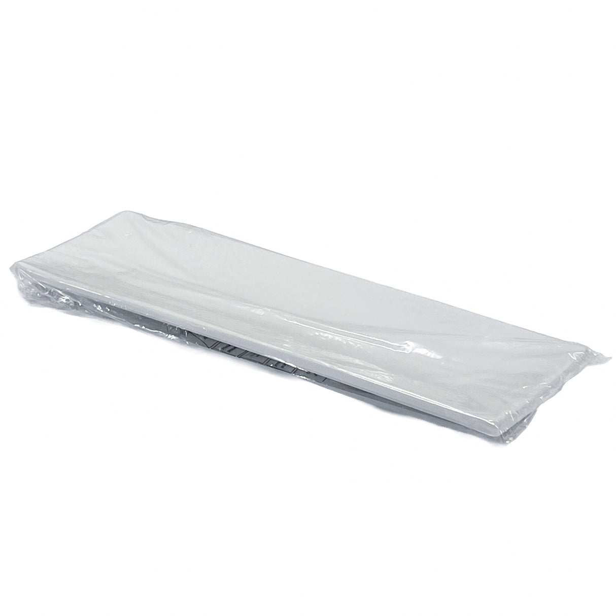 A stack of white rectangular paper towels or napkins is wrapped in clear plastic packaging, lying flat on a plain white background—perfect for pairing with your Frostone Collection Dish to keep table settings clean and organized.