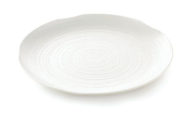 A round, white pebbled tray with a textured, concentric circular pattern on its surface. This 22 inch serving tray has a slightly raised rim and a glossy finish, photographed against a white background.