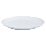 A plain, round melamine tray with a slightly raised rim and a smooth, glossy finish, photographed against a white background. The tray is empty and viewed at a slight angle, showing its shallow depth.