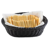 A black hand-woven basket from the Ridal Collection, lined with a white cloth, is filled with neatly arranged rectangular golden-brown crackers standing upright. The background is plain white.