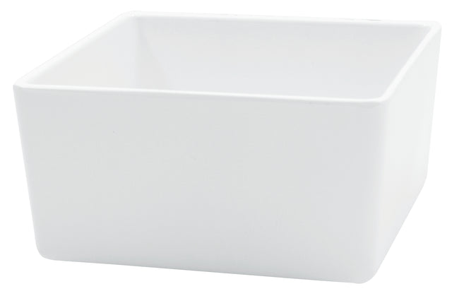 A plain, white, square ceramic bowl with smooth edges and a matte finish, shown empty against a white background. Dishwasher safe, this modern bowl features slightly rounded corners for a simple yet stylish design.