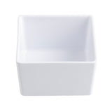 A plain, empty, white square ceramic dish with smooth sides and a glossy finish, shown from a slightly elevated angle on a white background—perfect as a dishwasher safe bowl for effortless cleanup.