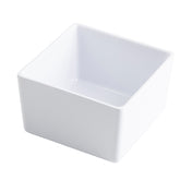 A plain, white, square ceramic bowl with smooth edges and a glossy finish, shown at an angle on a white background. This dishwasher safe bowl features clean, modern lines and is empty.