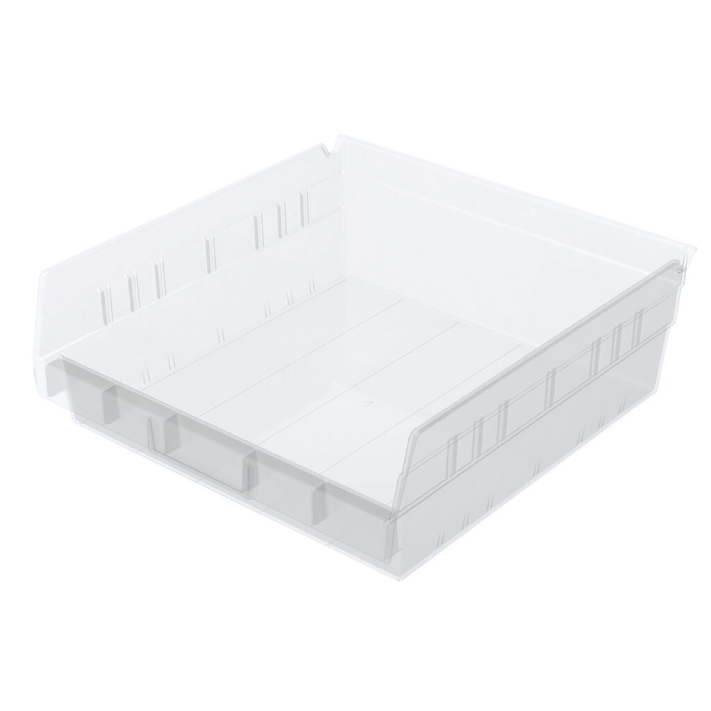 A clear Shelf Bin with straight sides, a wide flat base, and slightly raised edges. The front edge is lower than the sides and back, featuring horizontal grooves and molded handles for easy nesting. The background is plain white.