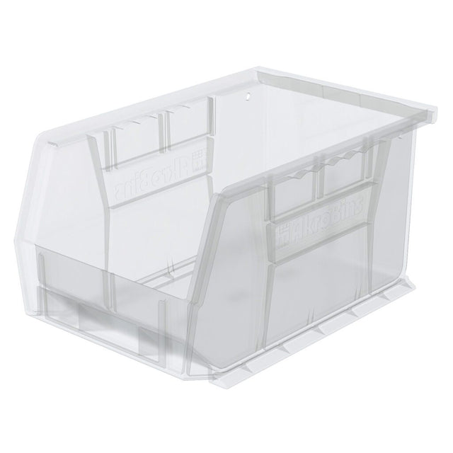 A clear stacking bin with a slanted open front for easy access. This transparent Supply Bin features reinforced sides, bottom grooves, and a small hole on the back for optional wall mounting. The bin is empty and perfect for organized clear storage.