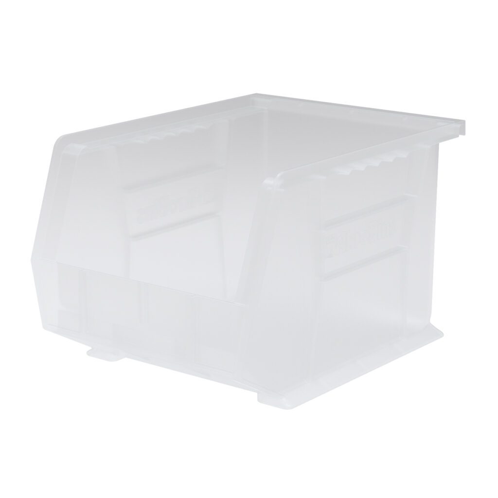 A clear stacking bin with an open front, slightly sloped sides, and a rectangular shape. Grooved grips on the sides make handling easy. The Supply Bin is empty and set against a plain white background.