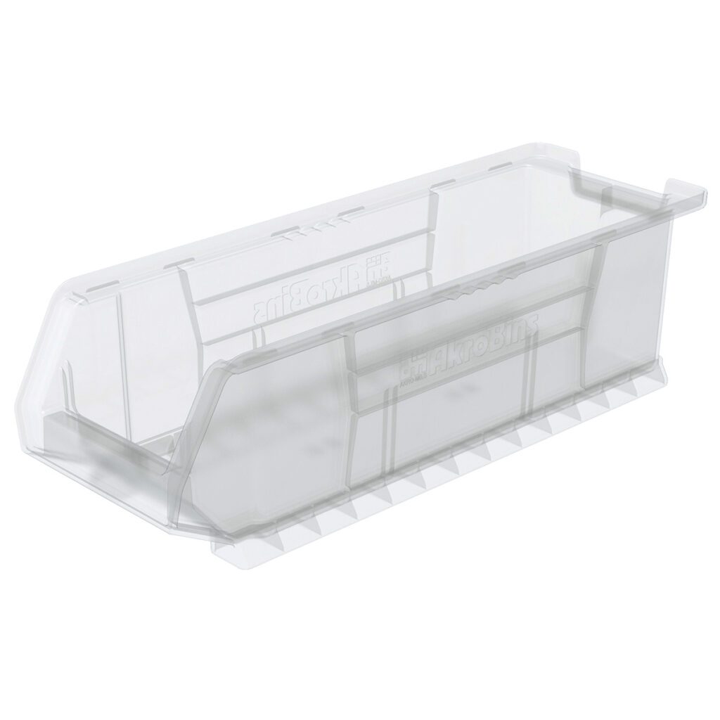 A clear stacking bin with angled sides and a slightly raised back. This empty storage bin has a flat base with vertical ridges for stability, while the open front edge offers easy access to contents—perfect as a Large Supply Bin.