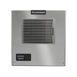 Front view of a stainless steel Scotsman air-cooled ice maker. The unit features a large central air vent with horizontal slats, a small control panel with buttons and icons below to the left, and the Scotsman logo at the top above the panel.