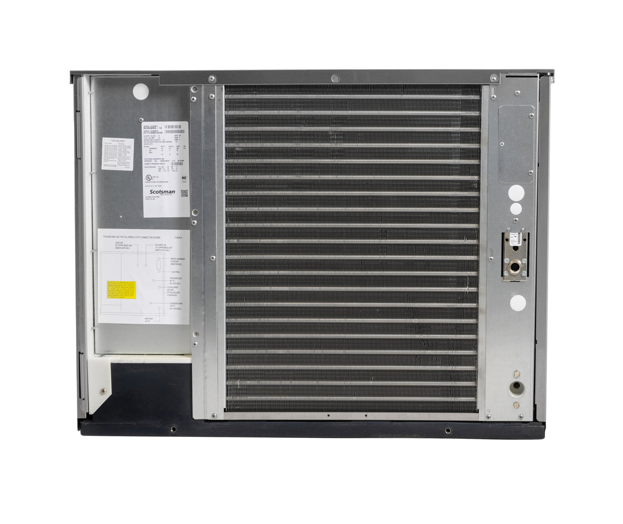 A large metal Prodigy ELITE HVAC evaporator coil unit is shown facing front. The right side displays a dense grid of air-cooled fins, while the left features a panel with technical diagrams, labels, and a yellow sticker. Tubing and controls are included.