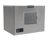 A commercial stainless steel ice maker, featuring a vented panel on the front and a Scotsman brand label above it, showcases its Prodigy ELITE cube style design with a small control panel in the lower left corner. Box-shaped and set against a white background.