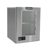 A stainless steel Scotsman cube style ice maker with two horizontal vent grilles on the front, air-cooled operation, a digital control panel with buttons and indicator lights in the lower left, and a black brand logo at the top. Clean lines complete its boxy, industrial design.