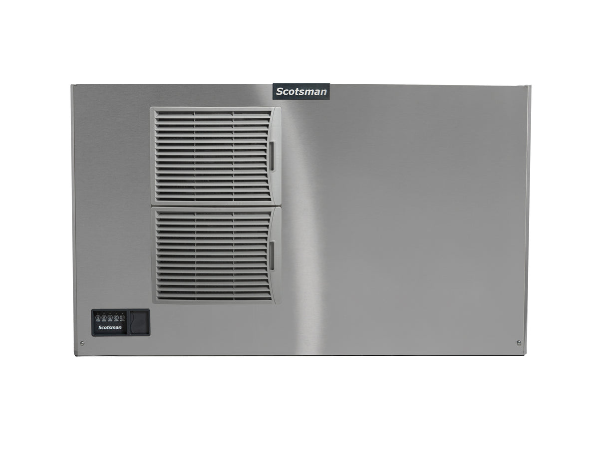 A stainless steel Prodigy ELITE Ice Maker is viewed from the front, featuring two horizontal vented panels on the left side, a black control panel in the lower left corner, and a “Scotsman” logo near the top center. The surface is smooth and metallic.