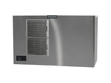 A commercial ice machine, the Scotsman Prodigy ELITE Ice Maker features two front ventilation grills, a small control panel on the lower left, and a smooth metallic surface. The Scotsman logo sits top center against a plain white background.