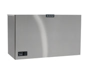 A large, rectangular stainless steel Prodigy ELITE Ice Maker with a smooth surface displays the “Scotsman” logo near the top center. This commercial ice machine features a small digital control panel on the lower left and is set against a white background.