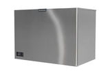 A large, rectangular stainless steel Prodigy ELITE Ice Maker with a smooth, brushed finish. The front features a small black digital display and Scotsman logo on top. This remote condenser ice maker sits on a flat white surface.