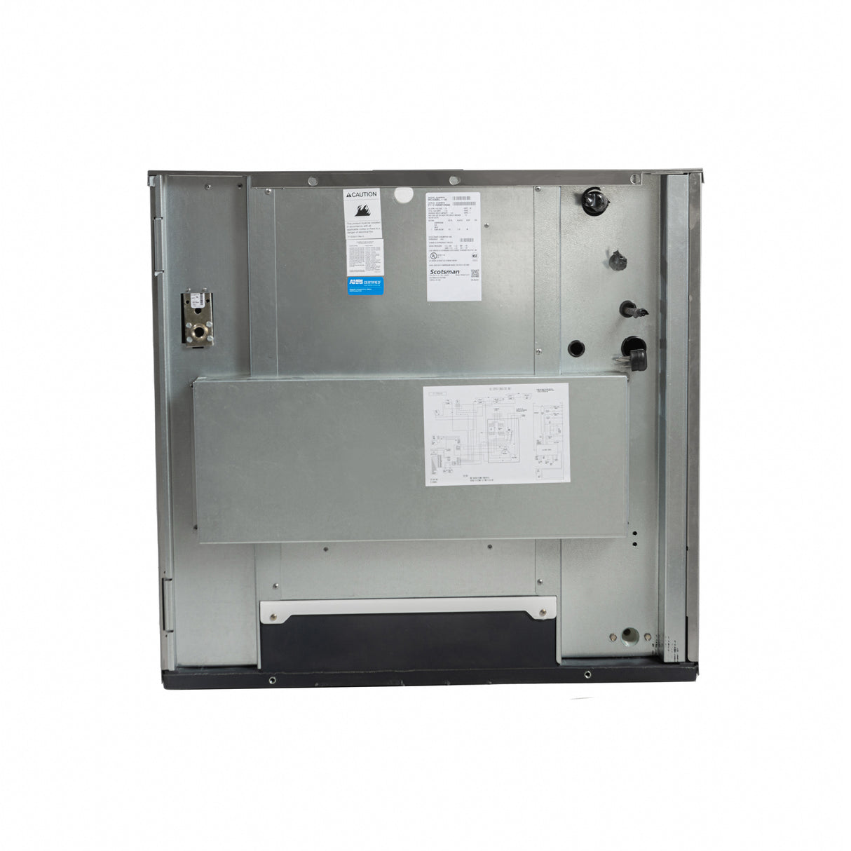 The image shows the back view of a large metallic appliance, possibly a Prodigy ELITE® Eclipse® Ice Maker. It features various ports, knobs, stickers with technical info, and a schematic diagram attached to the surface. The background is plain white.