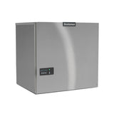 A silver, box-shaped Scotsman Prodigy ELITE® commercial ice maker with a smooth stainless steel finish. The front displays the Scotsman logo and a small control panel with indicator lights. Perfect as a high production ice machine for any business.