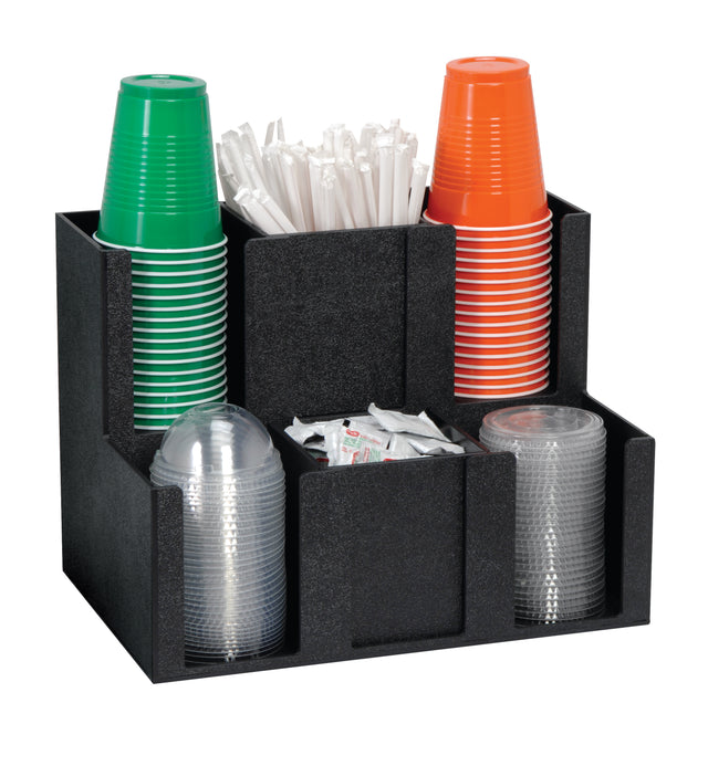 A black cup organizer holds stacks of green, red, and clear plastic cups, white drinking straws, and several sugar or condiment packets, all neatly separated into individual compartments.