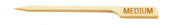 A TableCraft Products Meat Marker Pick made of bamboo, featuring a pointed tip, notched handle, and "MEDIUM" engraved on the right end—ideal for marking food doneness. The background is plain white.