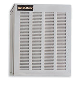 A silver stainless steel ice maker by Ice-O-Matic with two large vented panels on the front, a black and gold logo at the top left, and a boxy design. This water-cooled ice machine is set against a plain white background.