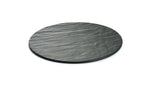 A round, flat, dark grey black slate serving plate with a textured, wavy surface pattern is shown against a white background. The plate appears thin, making it an ideal display tray with a natural, stone-like appearance.