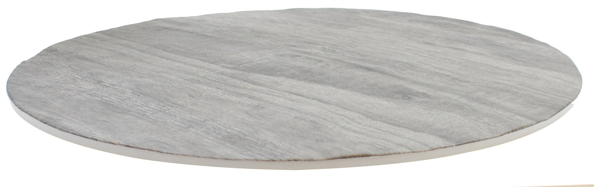 A round, flat, gray stone slab with subtle, natural-looking striations and a smooth texture sits on a white background. Its thin profile and slightly uneven edges evoke the handcrafted charm of a serving tray.