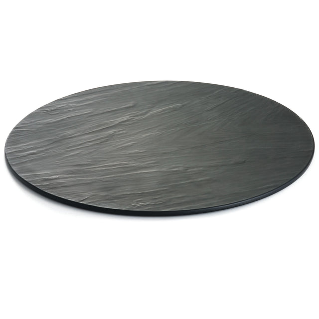 A round, flat, black Frostone Collection Display Tray with a textured surface and subtle grooves. This break resistant tray features a matte finish and is photographed on a white background.